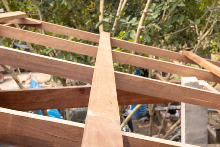 Wood structure frame under construction or installation for roof building consist of member i.e. purlins, rafter, stud beam, king post and column for suport roof sheet with slope.の写真素材