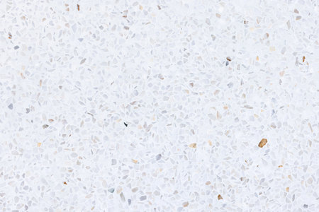 Terrazzo seamless texture background. New clean white bright and shiny surface. Small gravel mixed with mortar cement. Polished smooth for flooring, wall or cladding.の写真素材