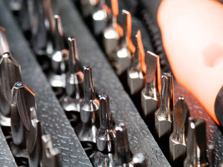 Set of screwdrivers close-up. The tool is in the box. Other metal tools.の写真素材