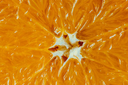 Close up of a slice of orange fruit as a background. Macroの写真素材