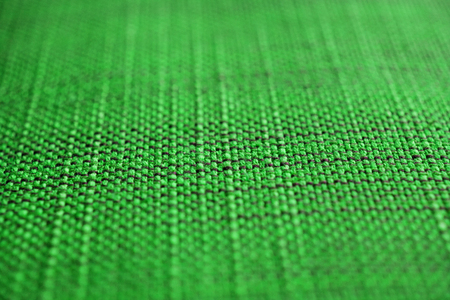 Green fabric texture. Cloth background. Close up view of green fabric texture and background. Abstract background and texture for designers.の写真素材