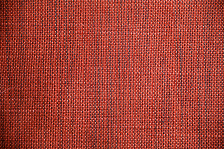 Red and orange fabric texture. Red and orange cloth background. Close up view of multicolored fabric texture and background. Abstract background and texture for designers. Cloth and Fabric texture.の写真素材