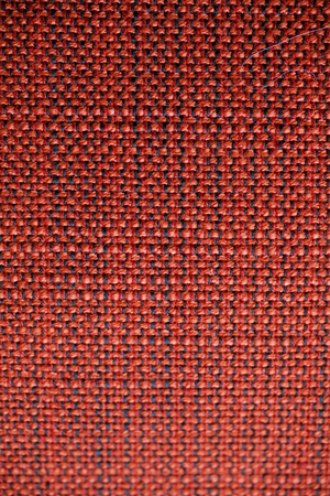 Red and orange fabric texture. Red and orange cloth background. Close up view of multicolored fabric texture and background. Abstract background and texture for designers. Cloth and Fabric texture.の写真素材