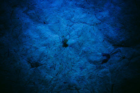 Abstract blue texture and background for designers. Vintage paper background. Rough blue texture of recycled paper. Closeup view of abstract dark blue texture. Vintage blue paper.の写真素材