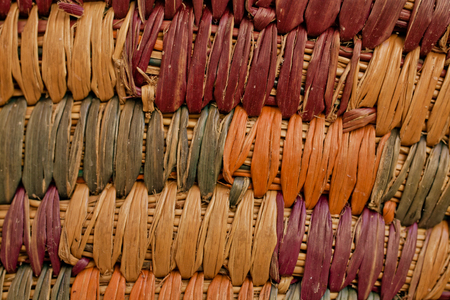 Colorful wicker basket background. Closed up wooden wicker texture background. Wicker handmade basket texture. Abstract texture and background for designers.の写真素材