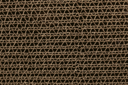 Macro texture of cardboard. Cardboard corrugated pattern. Abstract texture and background for designers. Brown paper texture and pattern. Closeup view of cardboard background.の写真素材