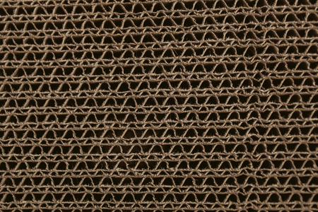 Macro texture of cardboard. Cardboard corrugated pattern. Abstract texture and background for designers. Brown paper texture and pattern. Closeup view of cardboard background.の写真素材