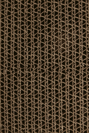 Macro texture of cardboard. Cardboard corrugated pattern. Abstract texture and background for designers. Brown paper texture and pattern. Closeup view of cardboard background.の写真素材