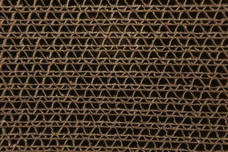 Macro texture of cardboard. Cardboard corrugated pattern. Abstract texture and background for designers. Brown paper texture and pattern. Closeup view of cardboard background.の写真素材