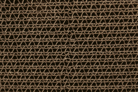 Macro texture of cardboard. Cardboard corrugated pattern. Abstract texture and background for designers. Brown paper texture and pattern. Closeup view of cardboard background.の写真素材