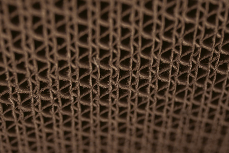 Macro texture of cardboard. Cardboard corrugated pattern. Abstract texture and background for designers. Brown paper texture and pattern. Closeup view of cardboard background.の写真素材