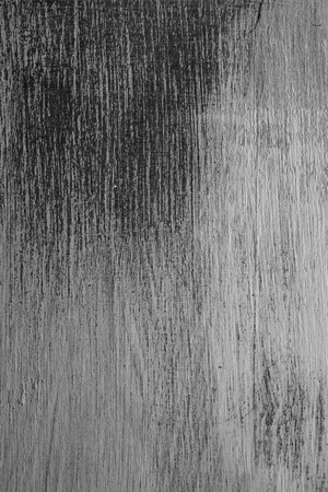 Rough texture of handmade table. Scratched vintage wood. Old vintage wood background. Closeup view of painted table and background for designers. Abstract texture and background.の写真素材