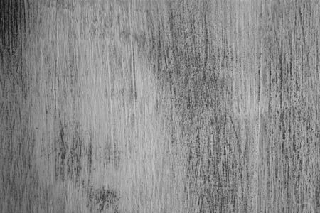 Rough texture of handmade table. Scratched vintage wood. Old vintage wood background. Closeup view of painted table and background for designers. Abstract texture and background.の写真素材