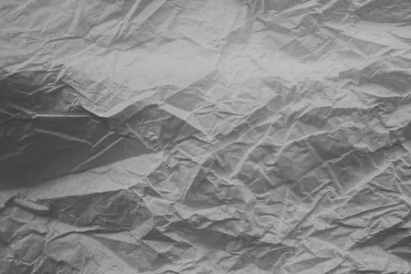 Rough white paper texture. Crumpled paper texture and background. Close up view of wrinkled white texture made with paper. Abstract texture and background for designers.の写真素材