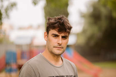 Portrait of young hispanic man staring seriously.の写真素材