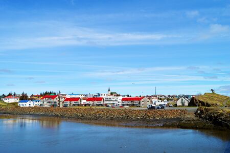 Borgarnes village view with waer fjord reflection in a sunny day, Icelandの写真素材