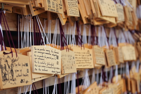 Tokyo, Japan  August 5th, 2017: Detail of wishes written on the wooden boards called "emas" placed by visitors at the Meiji Shrine, a temple dedicated to the Emperor Meiji and his wife.のeditorial素材