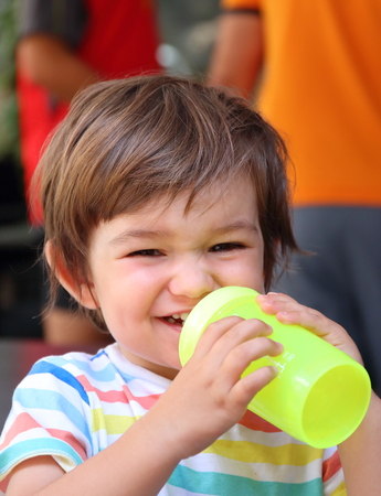 Portrait of a really cheerful 20 months old child that enjoys summer holidays in the Pyrenees mountains, Spain.の写真素材