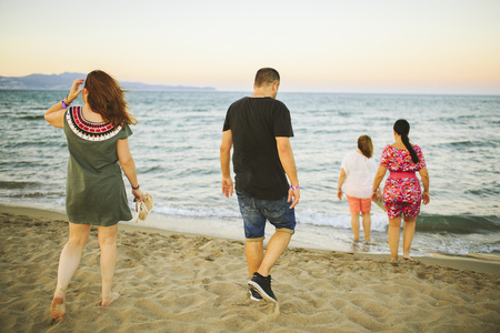 Friends enjoying on the beachの写真素材