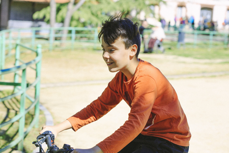 Boy with his bicycleの写真素材
