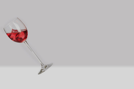 Glass cup with red liquid and iceの写真素材