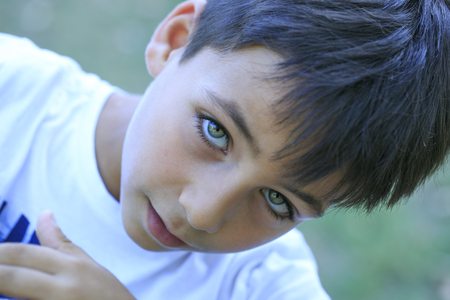 Boy with beautiful green eyesの写真素材