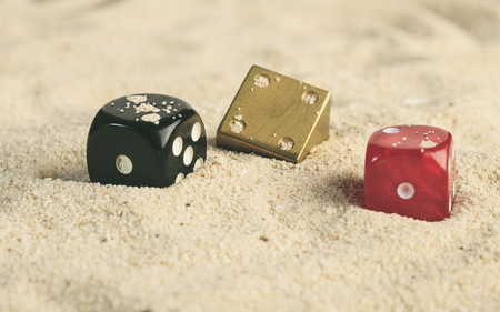 some dices in the sand dunesの写真素材