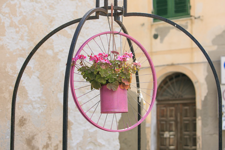 Pink bicycle wheel in  Alguero , sardinia, italyの写真素材