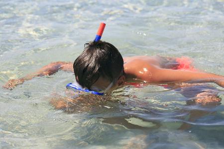Boy with snorkeling maskの写真素材