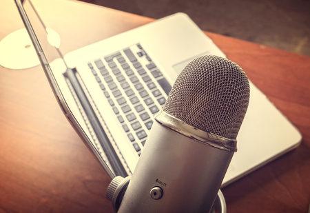 Lap top on a wooden tableの写真素材