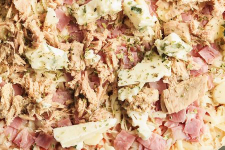 Pizza of ham, tuna and roquefort cheeseの写真素材