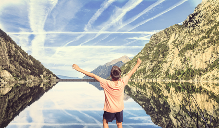 boys seeing mountains and lake sited in  the Pirineosの写真素材