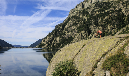 boy in a Mountains and lake photo with reflectionの写真素材