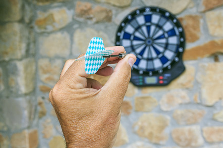 Bullseye on a wall with some dartsの写真素材