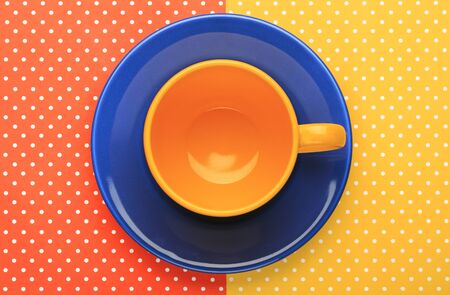 Dish and cup with colorful topped backgroundの写真素材