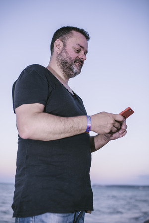 man making a photo on the beachの写真素材