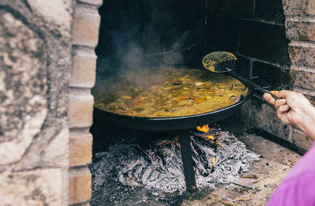 Typical spanish paella in the fireの写真素材