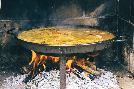 Typical spanish paella in the fireの写真素材