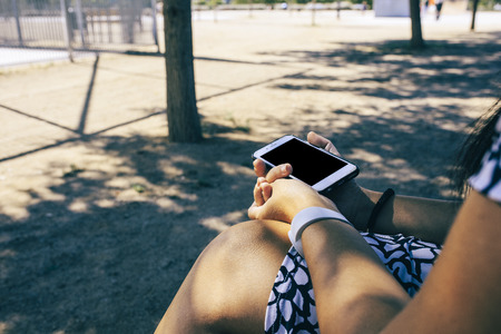 woman with smartphone streetの写真素材