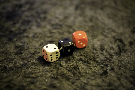 three dices on a tableの写真素材