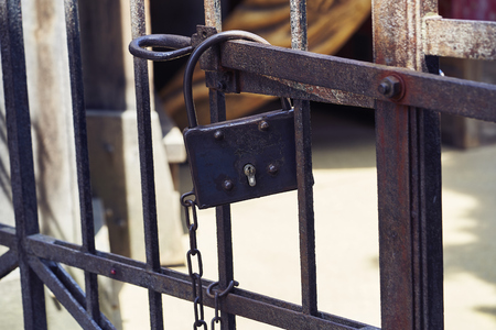 Rusty lock on iron doorの写真素材