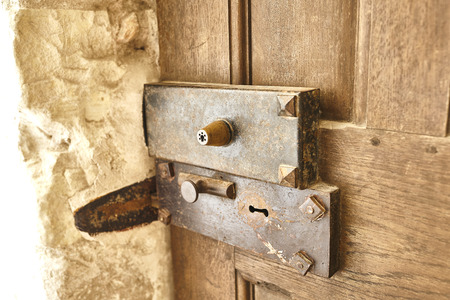old lock in a wooden doorの写真素材