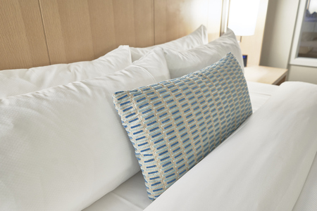 Fabric pillows in a bed