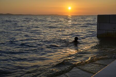 Silhouette in the Sunset of Zadar. Croatia. Europeの写真素材