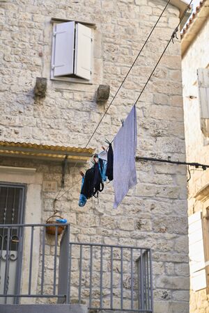 clothes hanged on the streetの写真素材
