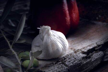 Spanish garlic ina rustic wooden table . The garlic are very good for circulationの写真素材