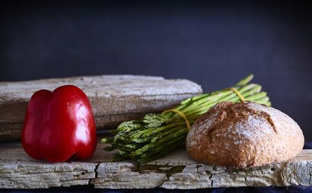 Mediterranean diet. Bread with vegetables composition in a wooden tableの写真素材