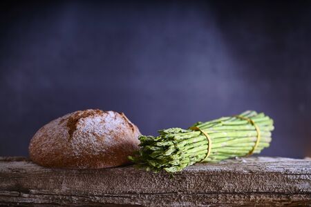 Fresh green asparagus on wooden table background. Healthy lifestyle concept.の写真素材