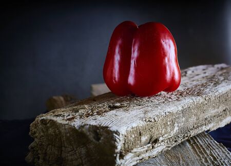 Red sweet pepper in a wooden table . Healthy foodの写真素材