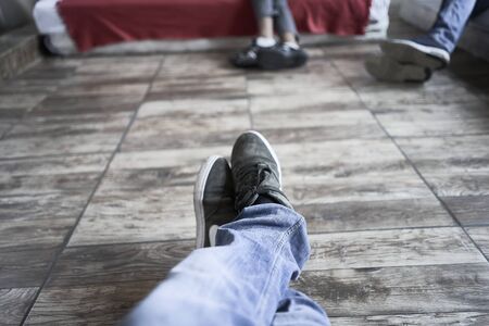 Handsome man sleeping in his sofa. Legs viewの写真素材